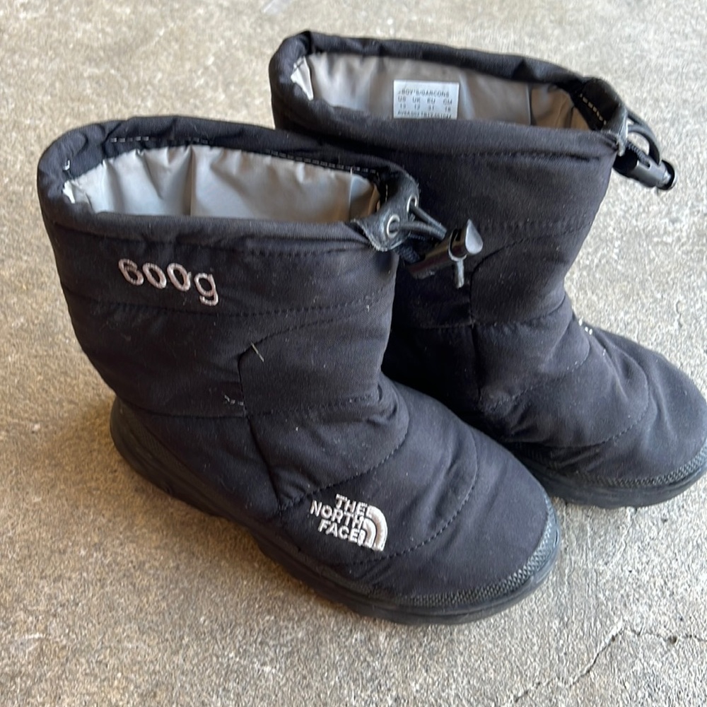 Black unisex north face nuptse boots